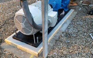 Grouting BaseTek PoxyBase in field with centrifugal pump and motor
