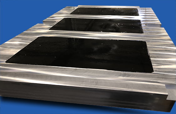 Polymer concrete filled weldment with floated surface