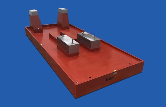 Pedestal mounted polymer pump base with embedded steel pads and sloped deck